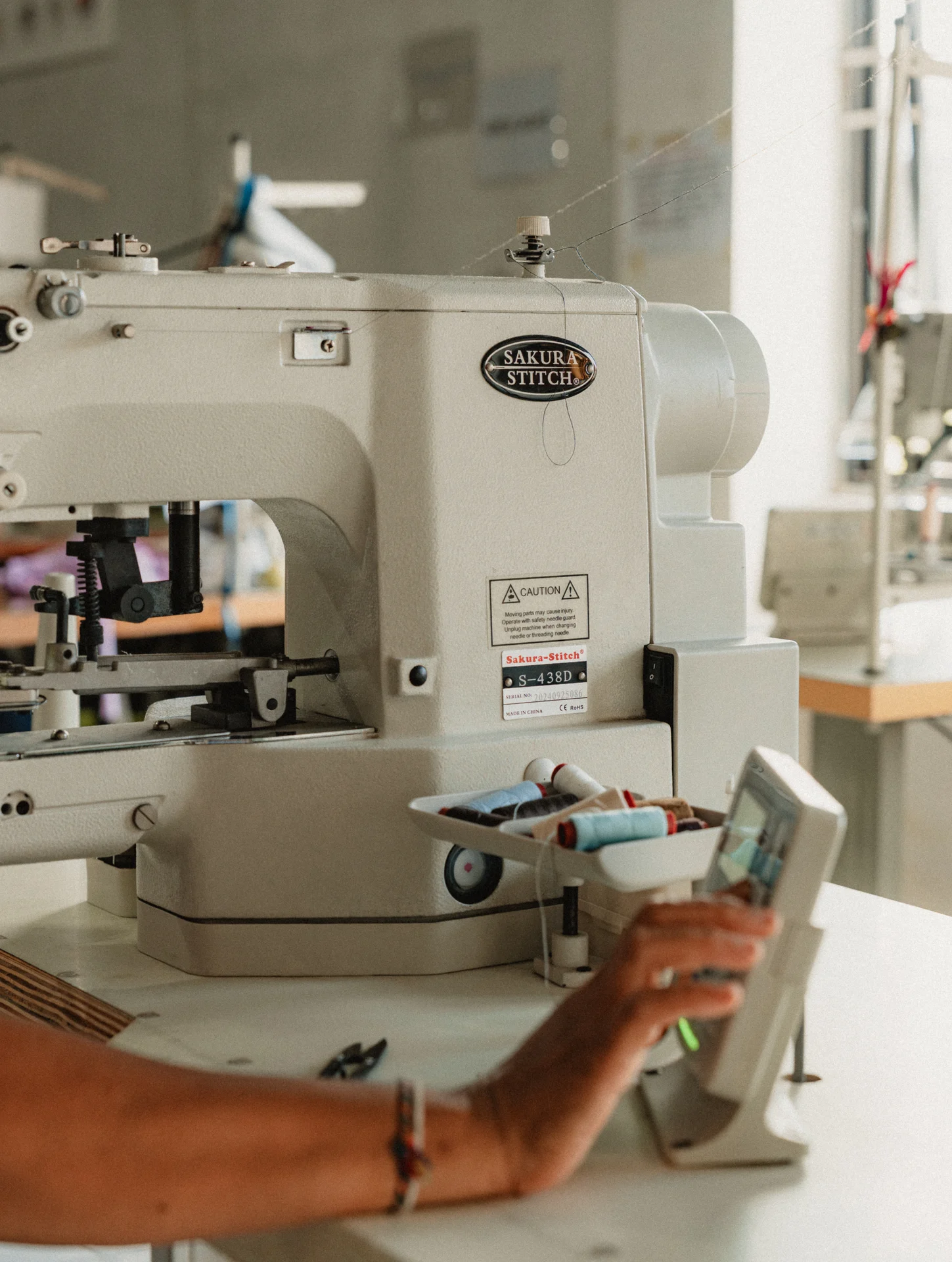 Automatic Buttonhole Machine used for sustainable clothing production in Bali