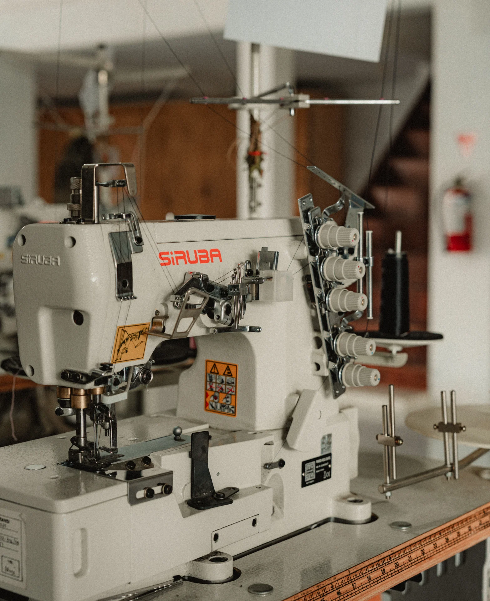 Industrial Overlock Machine used for sustainable clothing production in Bali